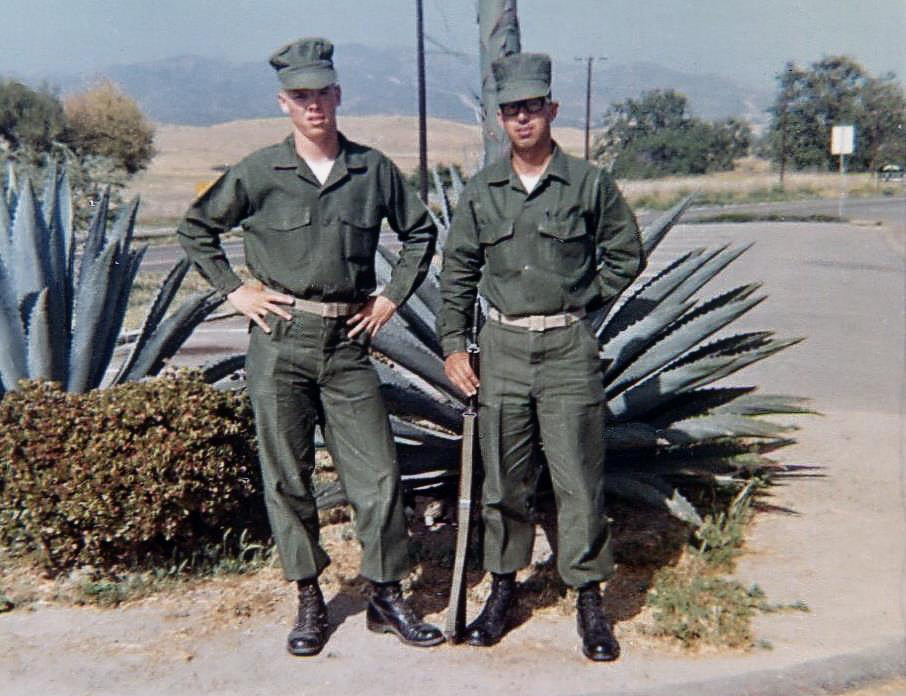 Two young Marines in training, posed by an agave plant